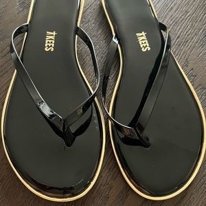 Tkees Liner Black and Gold Flip Flops